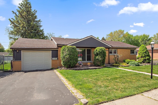 7009 W 115th Pl, Worth, IL 60482 - ranch-style home featuring brick siding, asphalt driveway, and a garage