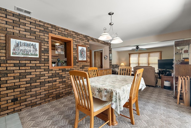 7009 W 115th Pl, Worth, IL 60482 - carpeted dining room with brick wall and a ceiling fan