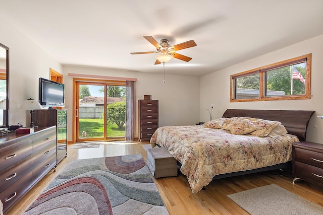 7009 W 115th Pl, Worth, IL 60482 - bedroom with light wood-type flooring, access to exterior, and ceiling fan