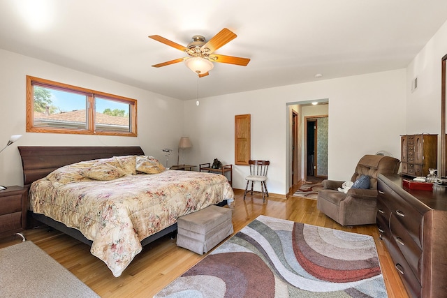 7009 W 115th Pl, Worth, IL 60482 - bedroom with light wood-style flooring and ceiling fan