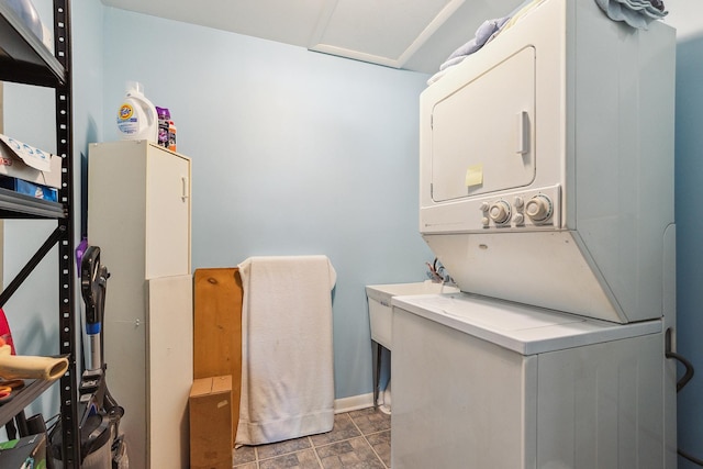 7009 W 115th Pl, Worth, IL 60482 - clothes washing area featuring stacked washing machine and dryer