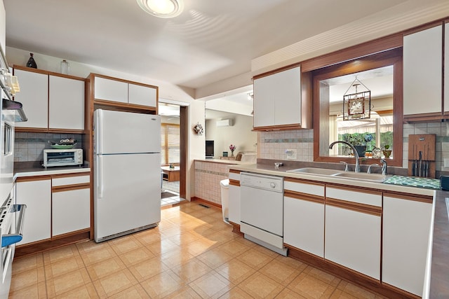 7009 W 115th Pl, Worth, IL 60482 - kitchen with white appliances, a sink, white cabinetry, and light floors