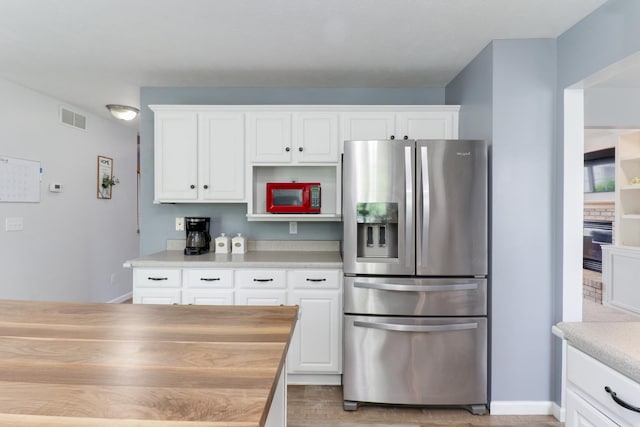 1505 Torrey Pines Rd, Normal, IL 61761 - kitchen featuring stainless steel refrigerator with ice dispenser, white cabinets, and light wood-style floors