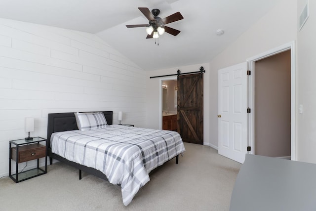 1505 Torrey Pines Rd, Normal, IL 61761 - bedroom with a barn door, lofted ceiling, light carpet, a ceiling fan, and connected bathroom