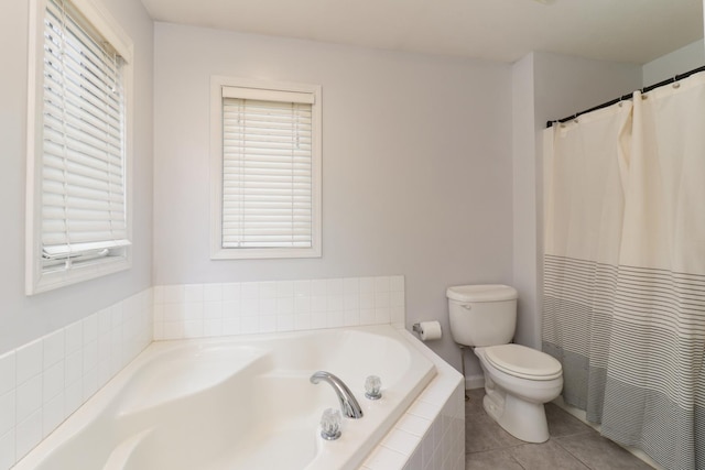 1505 Torrey Pines Rd, Normal, IL 61761 - bathroom featuring toilet, a bath, and tile patterned floors