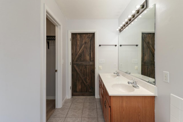 1505 Torrey Pines Rd, Normal, IL 61761 - bathroom featuring double vanity, a spacious closet, and tile patterned flooring