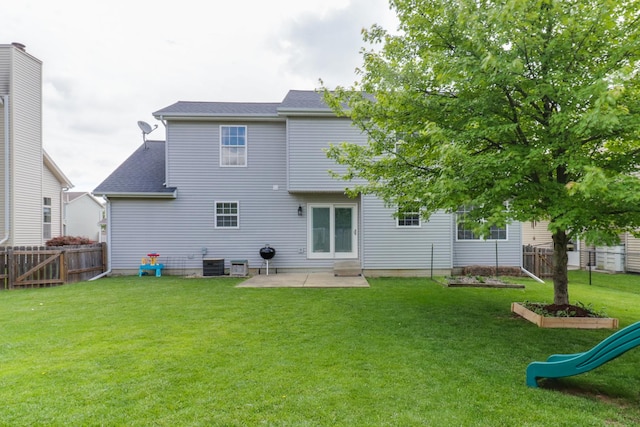 1505 Torrey Pines Rd, Normal, IL 61761 - back of property featuring a patio, central air condition unit, and roof with shingles