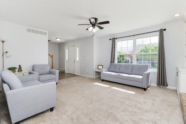 1505 Torrey Pines Rd, Normal, IL 61761 - carpeted living area featuring ceiling fan, stairway, and baseboards