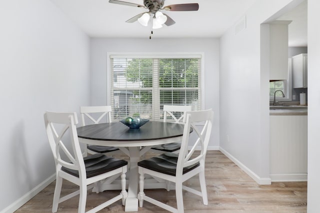 1505 Torrey Pines Rd, Normal, IL 61761 - dining space featuring ceiling fan, light wood-style flooring, and baseboards