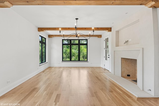 1107 Quassey Ave, Lake Bluff, IL 60044 - unfurnished living room featuring a chandelier, light wood finished floors, and beam ceiling