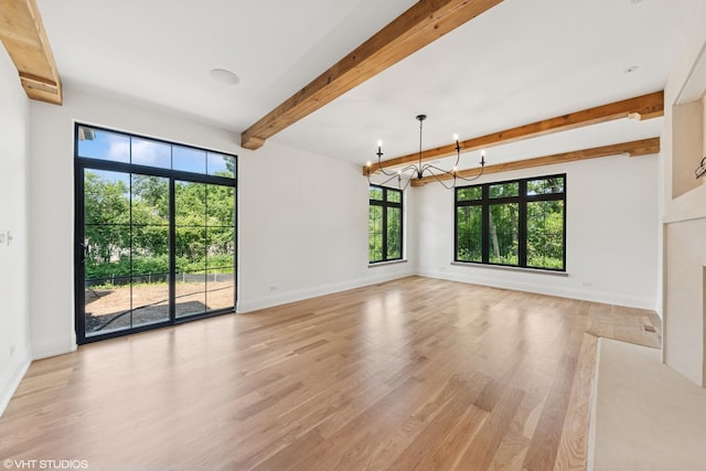 1107 Quassey Ave, Lake Bluff, IL 60044 - unfurnished living room with a chandelier, beam ceiling, healthy amount of natural light, and light wood finished floors