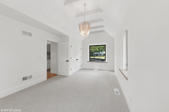 1107 Quassey Ave, Lake Bluff, IL 60044 - empty room featuring carpet, a chandelier, and vaulted ceiling