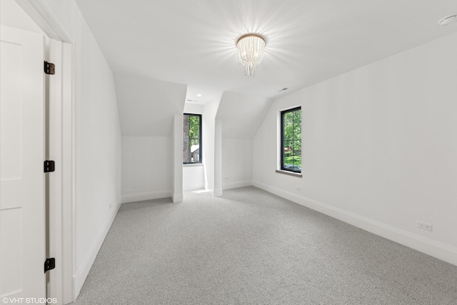 1107 Quassey Ave, Lake Bluff, IL 60044 - bonus room with light carpet, lofted ceiling, and a chandelier