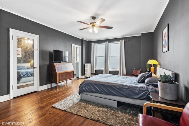 4940 S E End Ave Unit 17A, Chicago, IL 60615 - bedroom with radiator heating unit, wood finished floors, crown molding, and a ceiling fan