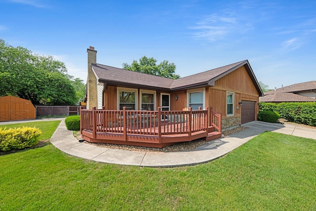 14356 S Birchwood Ct, Homer Glen, IL 60491 - rear view of house with a storage unit, a chimney, a wooden deck, concrete driveway, and an attached garage