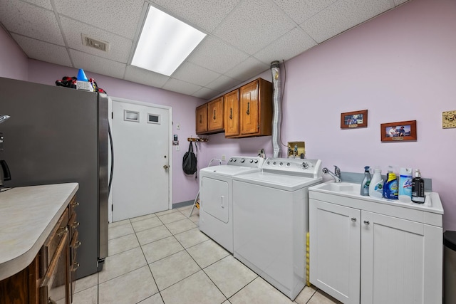 14356 S Birchwood Ct, Homer Glen, IL 60491 - washroom featuring separate washer and dryer, cabinet space, and light tile patterned flooring