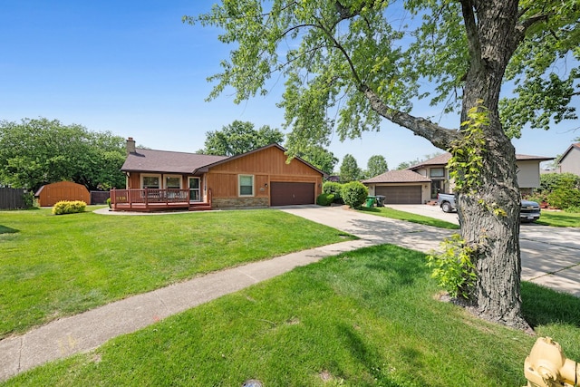 14356 S Birchwood Ct, Homer Glen, IL 60491 - view of front of home with stone siding, a chimney, a front lawn, and concrete driveway