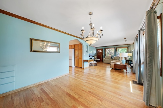 14356 S Birchwood Ct, Homer Glen, IL 60491 - living area featuring a chandelier, arched walkways, light wood-style flooring, and ornamental molding
