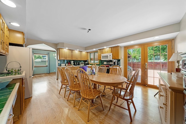 14356 S Birchwood Ct, Homer Glen, IL 60491 - dining space with light wood-type flooring, french doors, recessed lighting, and arched walkways