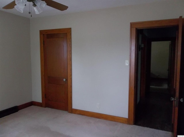 1619 Locust, Quincy, IL 62301 - empty room featuring light colored carpet, ceiling fan, and baseboards