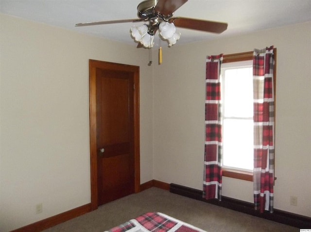 1619 Locust, Quincy, IL 62301 - spare room with healthy amount of natural light, a ceiling fan, and baseboards
