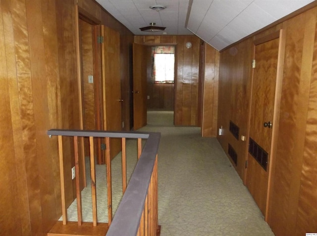 1619 Locust, Quincy, IL 62301 - hallway with wood walls, lofted ceiling, and carpet