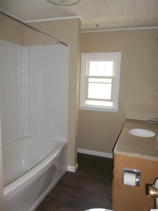 1619 Locust, Quincy, IL 62301 - full bathroom with wood finished floors, baseboards, ornamental molding, bathing tub / shower combination, and vanity