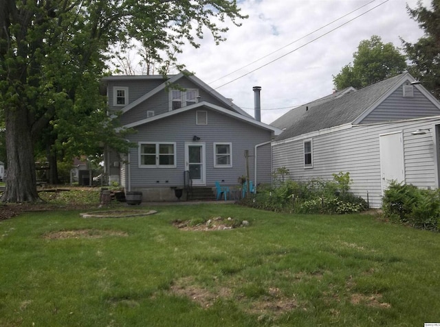 1619 Locust, Quincy, IL 62301 - rear view of house with entry steps and a yard