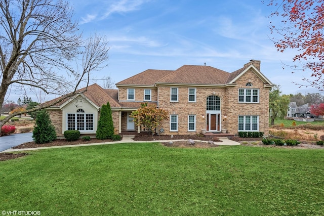625 Fielding Place Ct, Barrington, IL 60010 - colonial home with a chimney, a front lawn, and roof with shingles