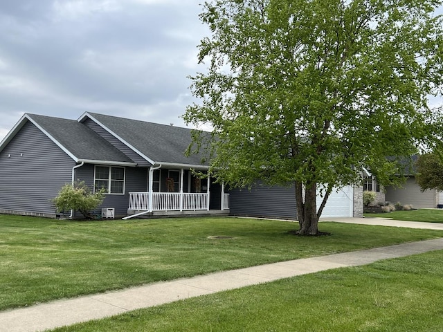 330 Centerpoint Dr, Bourbonnais, IL 60914 - view of front of house with covered porch, a garage, concrete driveway, a front lawn, and roof with shingles