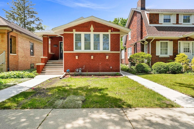 1115 N Taylor Ave, Oak Park, IL 60302 - view of front of home featuring brick siding, a front lawn, and a chimney