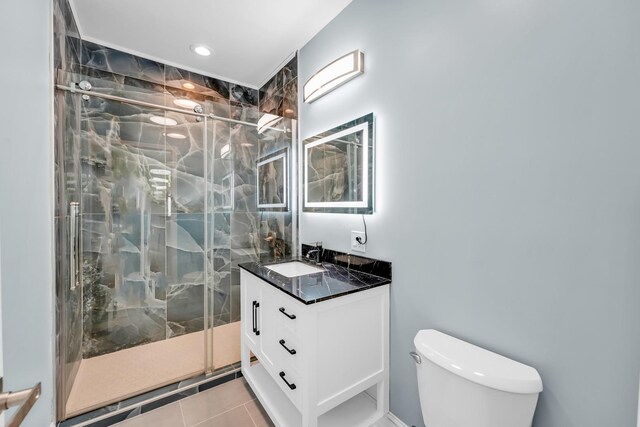 1115 N Taylor Ave, Oak Park, IL 60302 - full bathroom with a stall shower, toilet, vanity, tile patterned flooring, and recessed lighting
