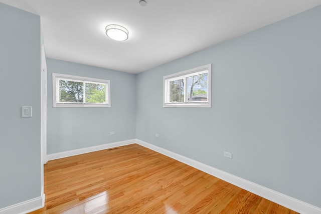 1115 N Taylor Ave, Oak Park, IL 60302 - spare room with baseboards and light wood-style flooring