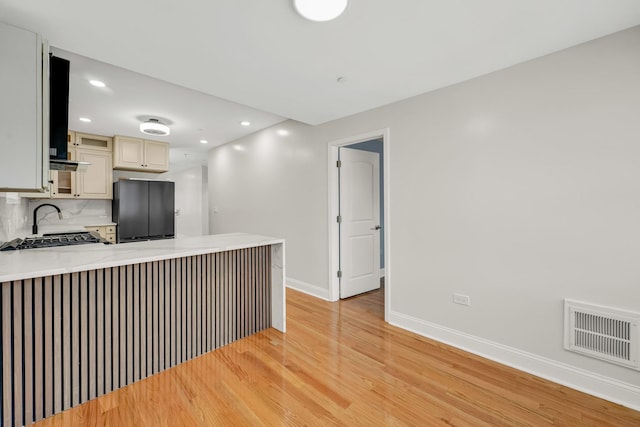 1115 N Taylor Ave, Oak Park, IL 60302 - kitchen featuring freestanding refrigerator, light wood-type flooring, baseboards, cream cabinets, and light countertops
