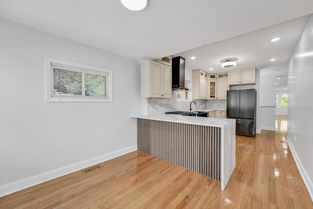 1115 N Taylor Ave, Oak Park, IL 60302 - kitchen featuring freestanding refrigerator, wall chimney exhaust hood, a peninsula, plenty of natural light, and recessed lighting