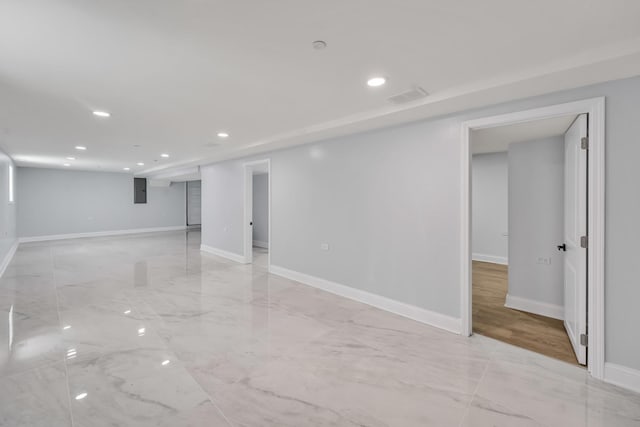 1115 N Taylor Ave, Oak Park, IL 60302 - below grade area featuring recessed lighting, baseboards, light marble finish flooring, and electric panel