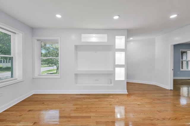1115 N Taylor Ave, Oak Park, IL 60302 - spare room featuring baseboards, light wood-style flooring, recessed lighting, and built in features