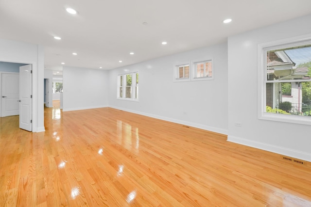 1115 N Taylor Ave, Oak Park, IL 60302 - unfurnished living room with light wood-style flooring, recessed lighting, and baseboards