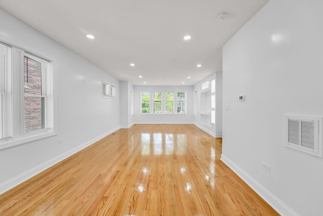 1115 N Taylor Ave, Oak Park, IL 60302 - unfurnished living room with light wood-type flooring, recessed lighting, and baseboards