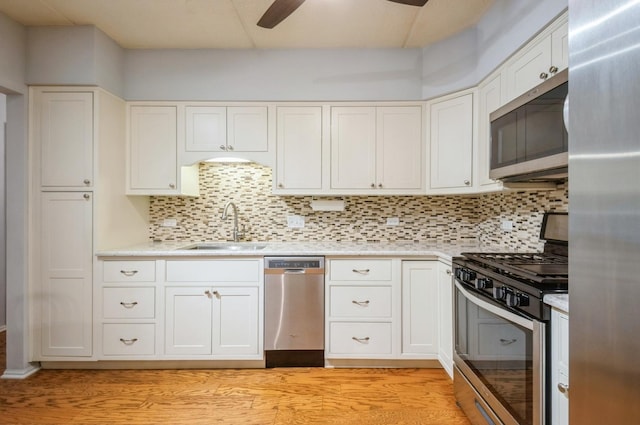 460 S NW Hwy Unit 309A, Park Ridge, IL 60068 - kitchen with stainless steel appliances, a sink, a ceiling fan, and light countertops