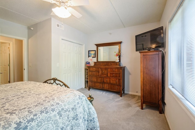 460 S NW Hwy Unit 309A, Park Ridge, IL 60068 - bedroom with light carpet, a closet, a ceiling fan, a textured ceiling, and baseboards