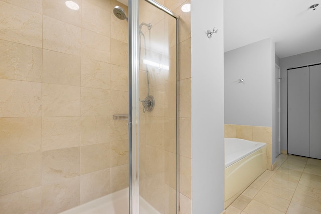 full bath featuring a shower stall and a bath