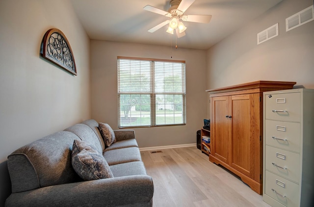 612 Freedom Way, Shorewood, IL 60404 - living room with light wood-style floors, a ceiling fan, and baseboards