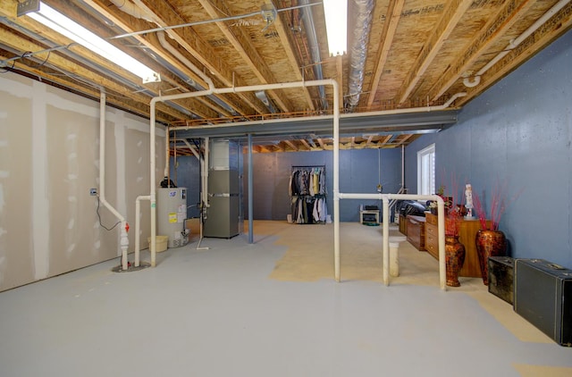 612 Freedom Way, Shorewood, IL 60404 - unfinished below grade area featuring water heater, heating unit, and drainage system