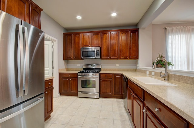 612 Freedom Way, Shorewood, IL 60404 - kitchen featuring appliances with stainless steel finishes, a sink, light tile patterned floors, light countertops, and recessed lighting