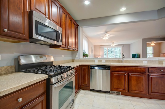 612 Freedom Way, Shorewood, IL 60404 - kitchen with stainless steel appliances, a sink, a ceiling fan, light countertops, and recessed lighting