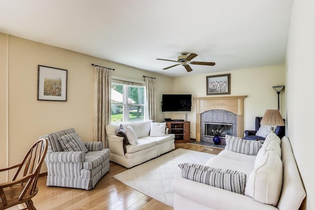 5506 Hickory Grove Ct, Plainfield, IL 60586 - living area with wood finished floors, ceiling fan, and a fireplace with flush hearth