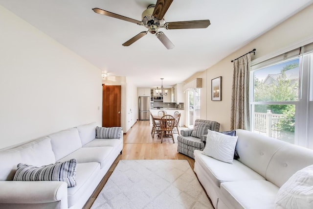 5506 Hickory Grove Ct, Plainfield, IL 60586 - living room featuring light wood-style flooring and a ceiling fan