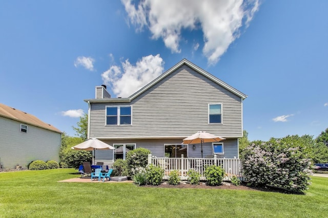 5506 Hickory Grove Ct, Plainfield, IL 60586 - rear view of property featuring a chimney, a lawn, and a patio