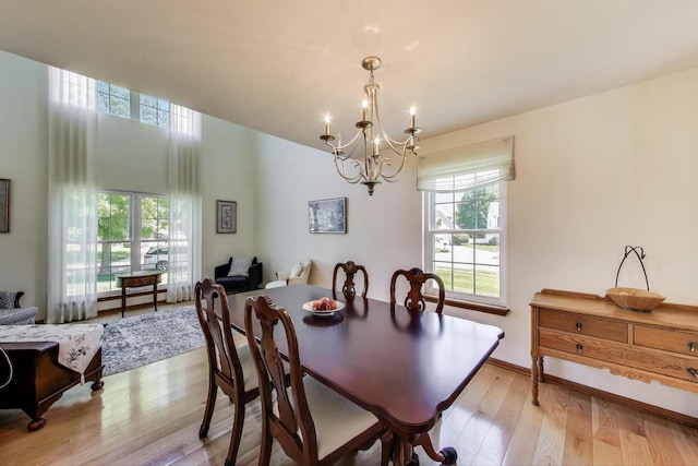 5506 Hickory Grove Ct, Plainfield, IL 60586 - dining area with a chandelier and light wood-style floors